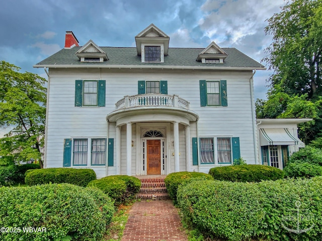 345 W Main St, Lock Haven, PA 17745 - view of front of home with a balcony, a shingled roof, and a chimney
