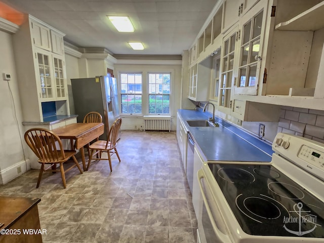 345 W Main St, Lock Haven, PA 17745 - kitchen with appliances with stainless steel finishes, radiator heating unit, glass insert cabinets, and white cabinets
