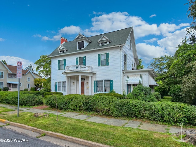 345 W Main St, Lock Haven, PA 17745 - view of front of house with a chimney, a balcony, and a front yard