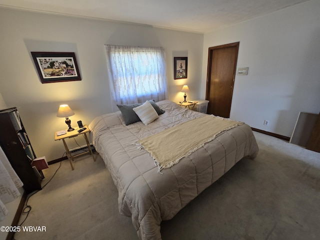 bedroom featuring baseboards and light colored carpet