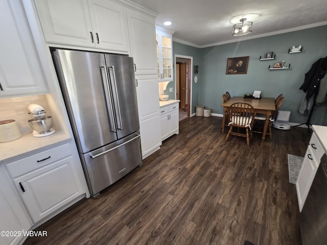 kitchen featuring dark wood finished floors, crown molding, white cabinetry, and high end refrigerator