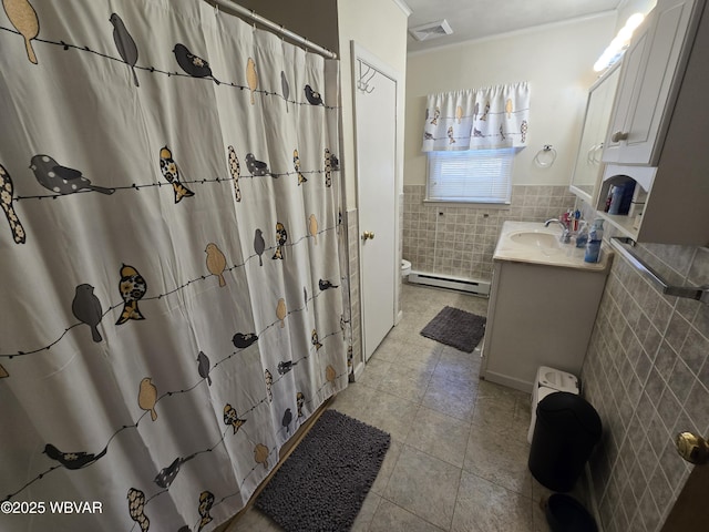 bathroom with tile patterned floors, visible vents, toilet, tile walls, and vanity