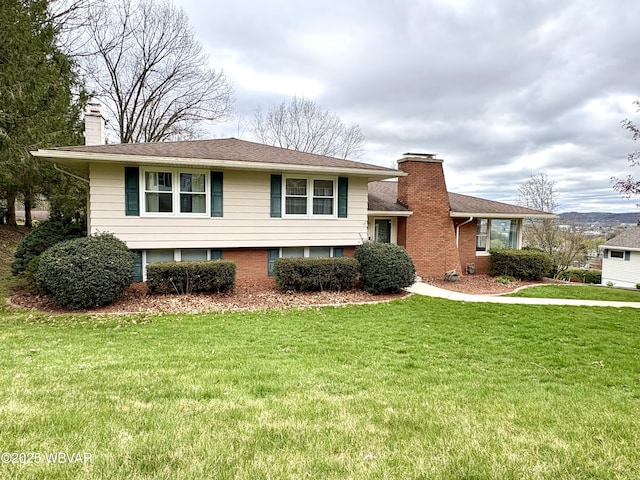 316 Winter St, Duboistown, PA 17702 - tri-level home featuring a front lawn, brick siding, and a chimney