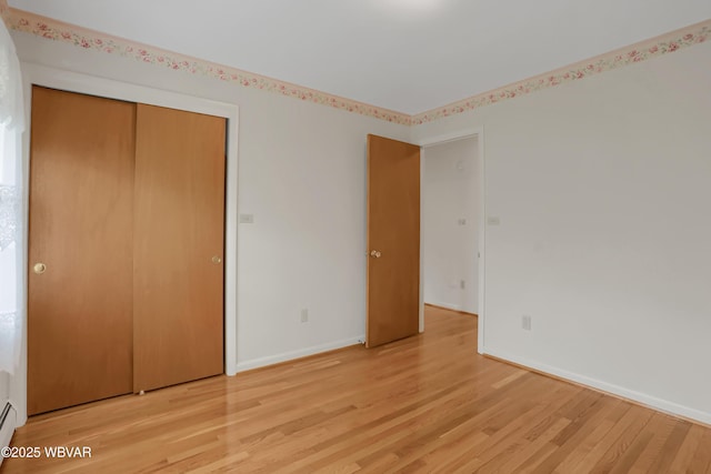 316 Winter St, Duboistown, PA 17702 - unfurnished bedroom with light wood-style flooring, baseboards, and a closet