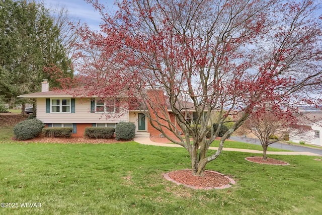 316 Winter St, Duboistown, PA 17702 - view of front of home featuring a chimney and a front yard