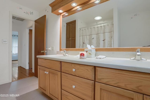316 Winter St, Duboistown, PA 17702 - bathroom featuring a sink, visible vents, and double vanity