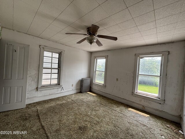 877-879 S 2nd St, Sunbury, PA 17801 - empty room with radiator, a ceiling fan, and carpet floors