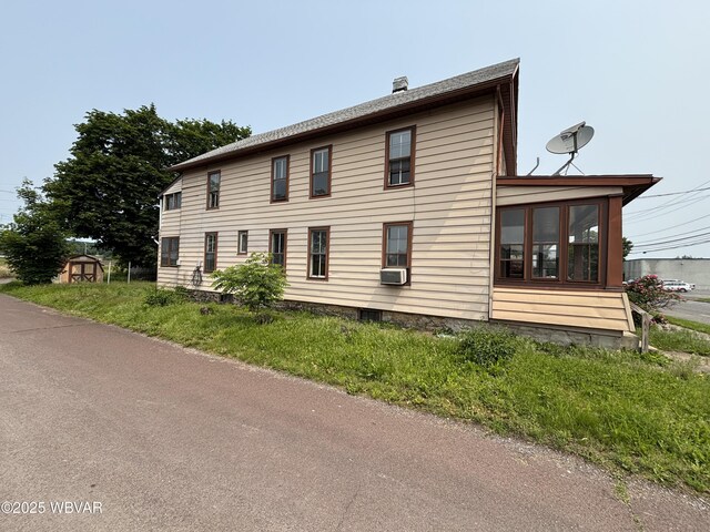 877-879 S 2nd St, Sunbury, PA 17801 - view of side of home with a chimney and cooling unit