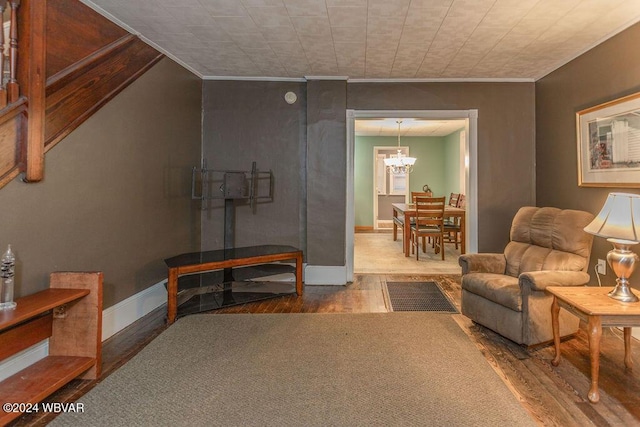 living room featuring hardwood / wood-style floors and a notable chandelier