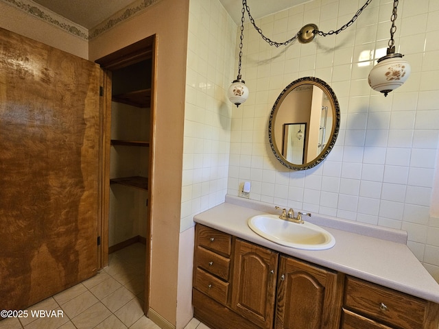 399 Sholder Rd, Williamsport, PA 17701 - bathroom featuring vanity, tile patterned floors, and tile walls