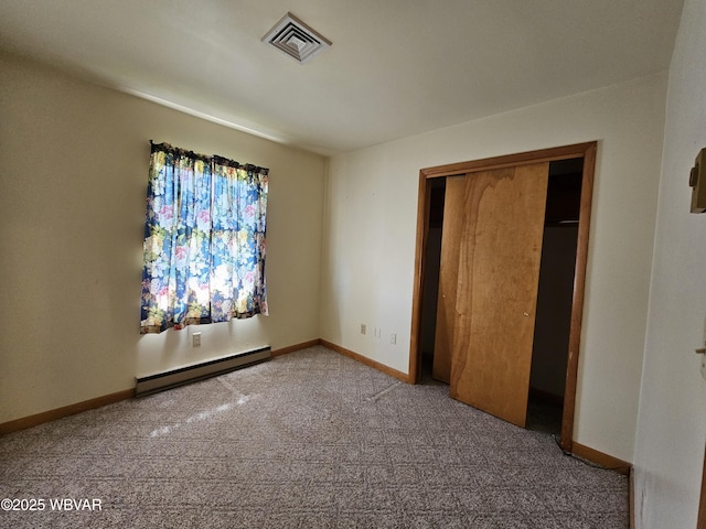 399 Sholder Rd, Williamsport, PA 17701 - unfurnished bedroom featuring a baseboard heating unit, carpet, baseboards, and a closet