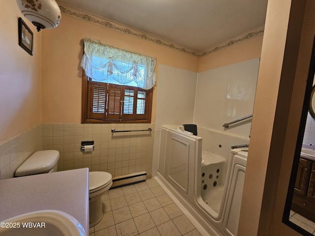 399 Sholder Rd, Williamsport, PA 17701 - bathroom featuring toilet, a baseboard heating unit, a whirlpool tub, tile walls, and tile patterned flooring
