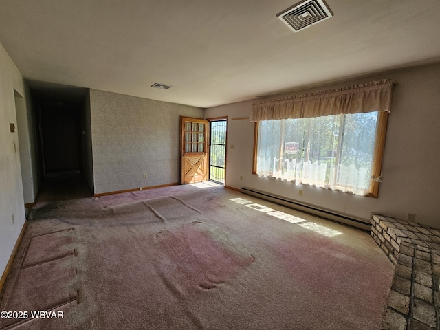 399 Sholder Rd, Williamsport, PA 17701 - carpeted empty room with a baseboard heating unit and baseboards