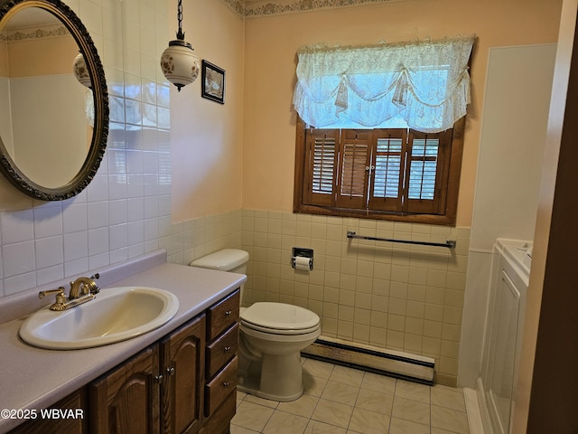 399 Sholder Rd, Williamsport, PA 17701 - bathroom featuring a baseboard heating unit, tile walls, wainscoting, tile patterned flooring, and toilet
