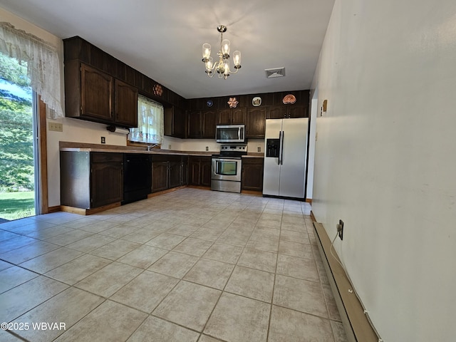 399 Sholder Rd, Williamsport, PA 17701 - kitchen featuring appliances with stainless steel finishes, a baseboard heating unit, a chandelier, dark brown cabinets, and light tile patterned floors