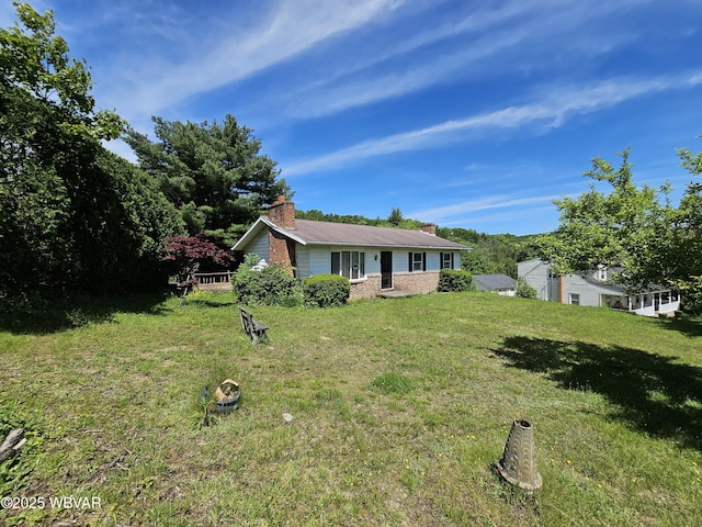 399 Sholder Rd, Williamsport, PA 17701 - view of front of house featuring a chimney and a front lawn