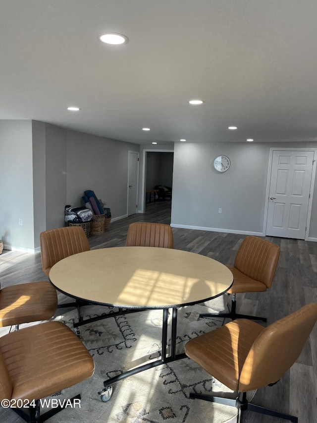 dining space featuring dark wood-type flooring