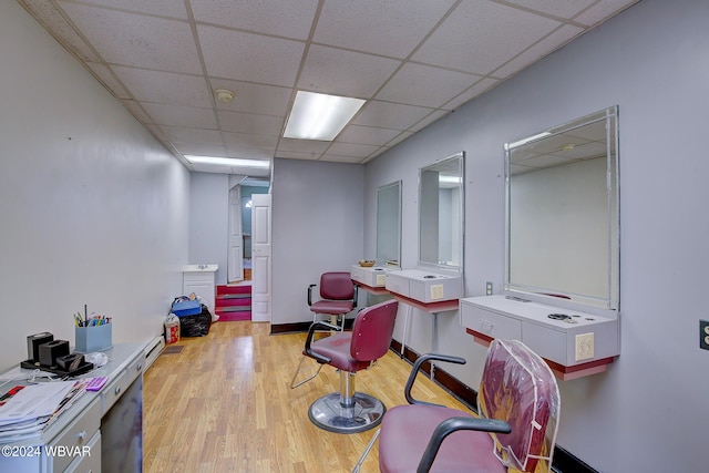 office space featuring light hardwood / wood-style flooring and a drop ceiling