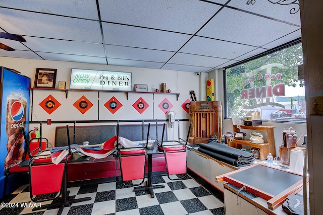 game room featuring a drop ceiling