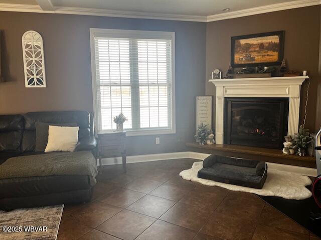 living room featuring crown molding and dark tile patterned floors