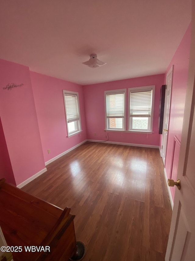 empty room featuring hardwood / wood-style flooring