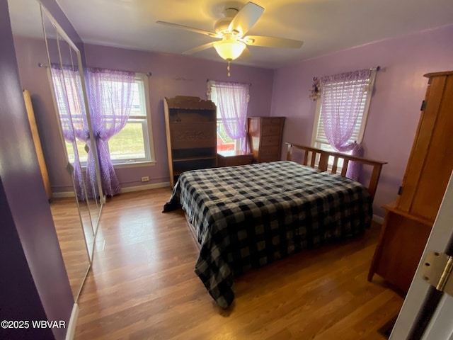 bedroom featuring ceiling fan and light hardwood / wood-style flooring