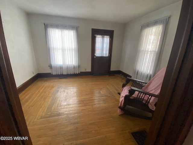 foyer featuring light parquet floors