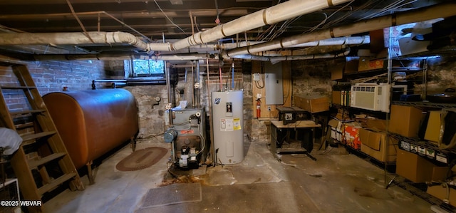 unfinished below grade area featuring heating fuel, electric water heater, and a heating unit