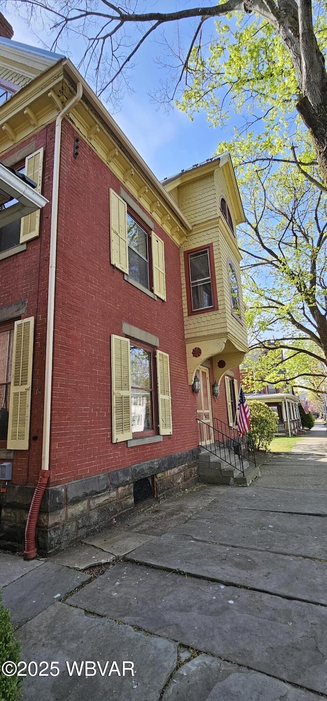 view of home's exterior featuring brick siding