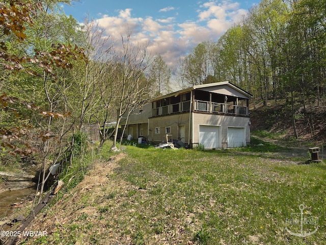 back of property with a garage
