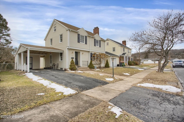 view of front of house with a carport