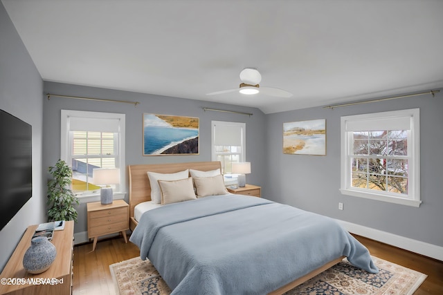 bedroom featuring dark hardwood / wood-style floors and ceiling fan