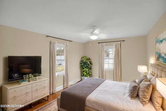 bedroom with hardwood / wood-style flooring and ceiling fan