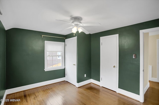 unfurnished bedroom with hardwood / wood-style floors and ceiling fan