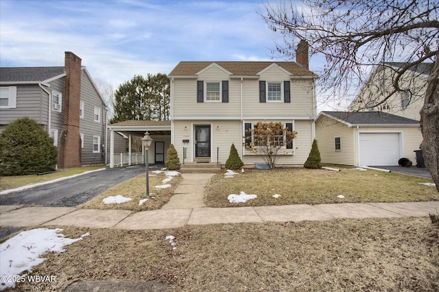 view of property with a front lawn and a carport