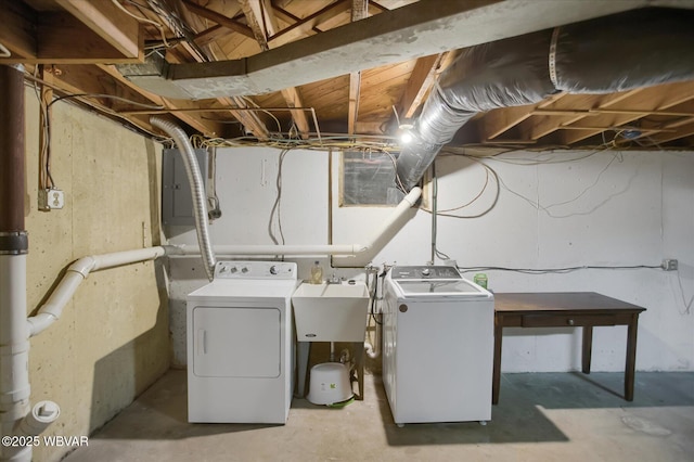 laundry room featuring separate washer and dryer and sink