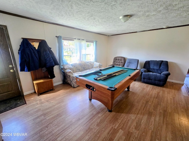 playroom with wood-type flooring, a textured ceiling, and pool table