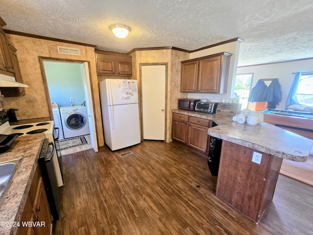 kitchen featuring white fridge, dark wood-type flooring, a textured ceiling, and a kitchen island