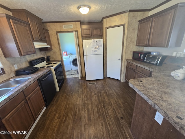 kitchen featuring dark hardwood / wood-style flooring, a textured ceiling, washer and clothes dryer, black appliances, and ornamental molding