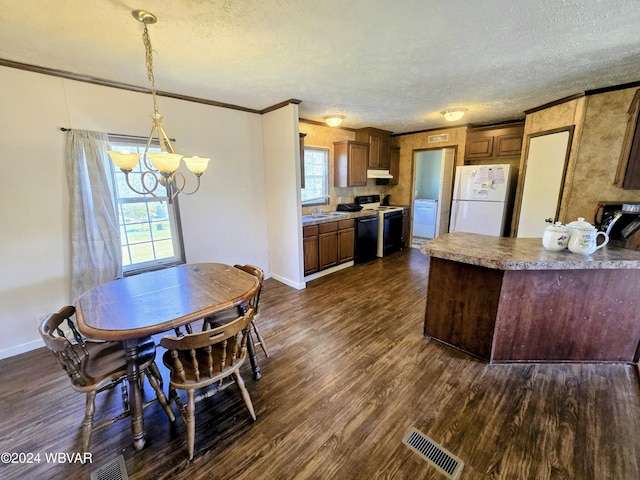 kitchen featuring black appliances, decorative light fixtures, a textured ceiling, a notable chandelier, and dark hardwood / wood-style flooring