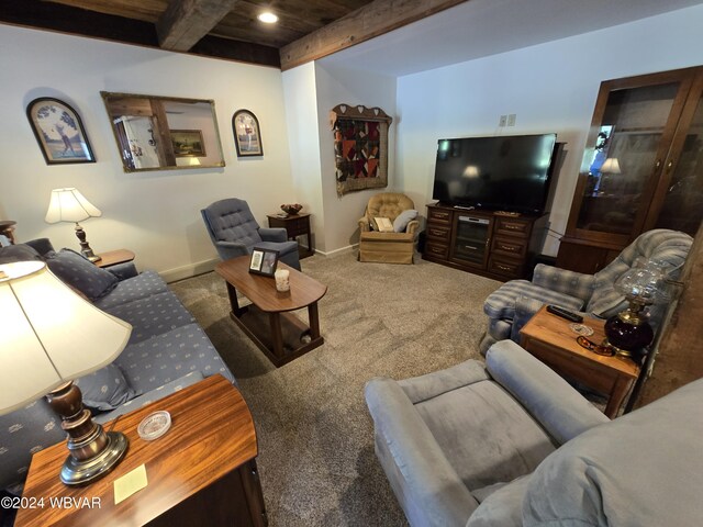 carpeted living room featuring beamed ceiling