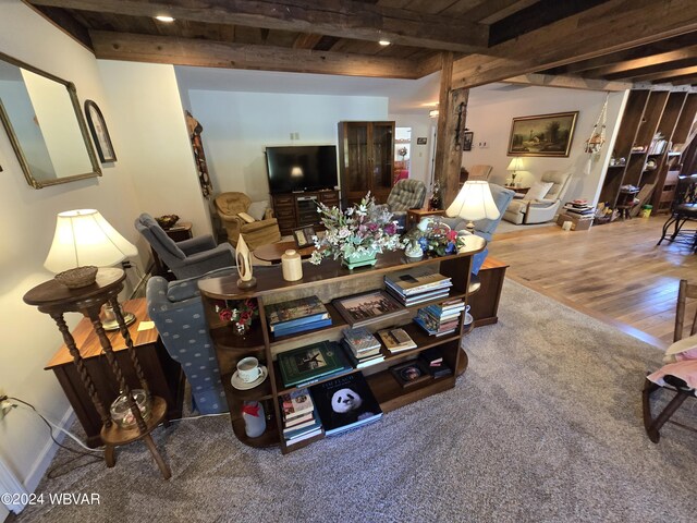 living room with hardwood / wood-style floors, beamed ceiling, and wooden ceiling