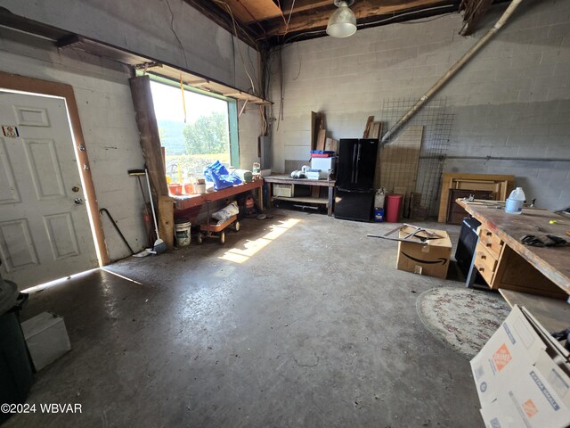 interior space featuring a workshop area and water heater