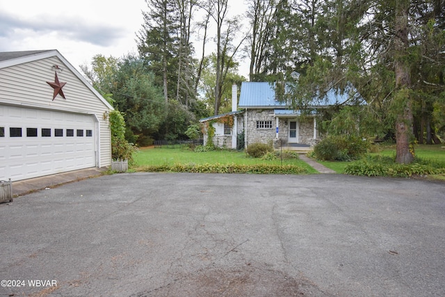 garage featuring a yard