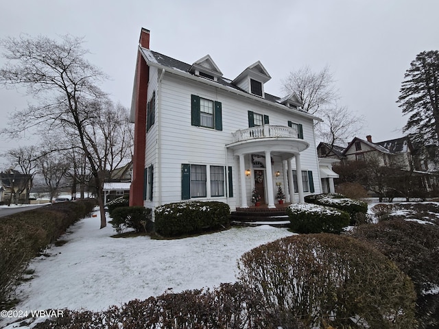 view of front of home with a balcony