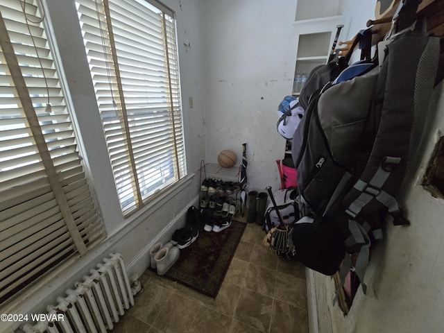 interior space with a wealth of natural light and radiator heating unit