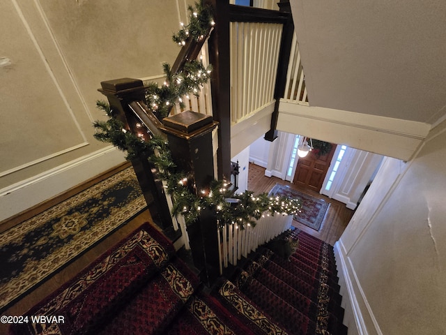 stairs with hardwood / wood-style floors