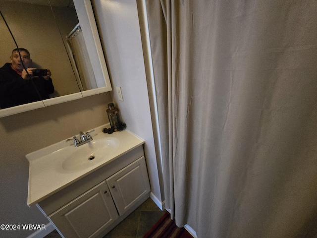 bathroom with tile patterned flooring and vanity