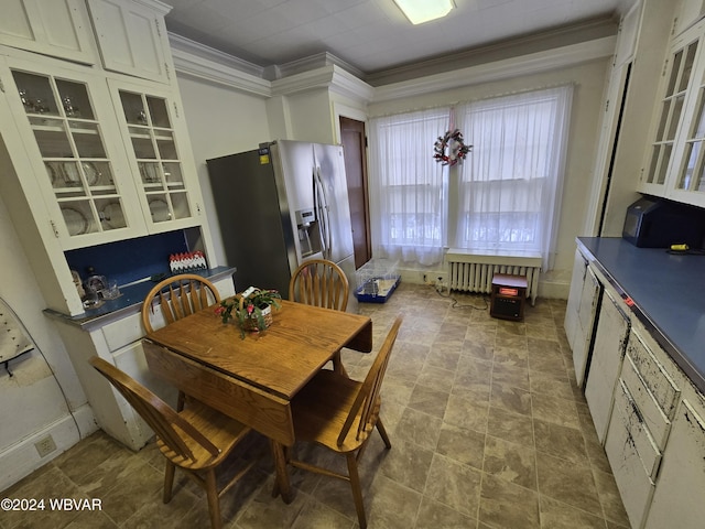 dining area with radiator and ornamental molding