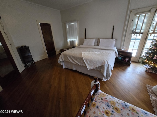 bedroom with wood-type flooring